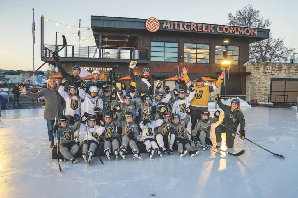 Youth hockey team posing at Millcreek Commons rink